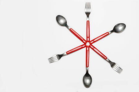 star shape formed by forks and spoonsの写真素材