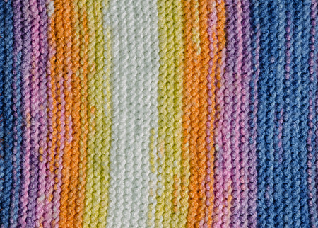 vertical colorful stripes of a knitted blanket