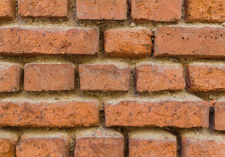 old decaying red brick wall
