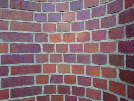 interesting brick wall with curved patterns of the colorful bricksの写真素材