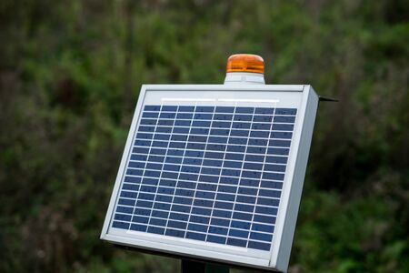 Solar panel in high way. Using solar panels to illuminate a stretch of roadの写真素材