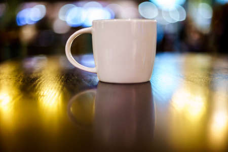 Coffee Lattee on the wooden table with back lightの写真素材