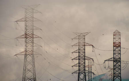 Industrial electricity pylons and pollution from energy plant