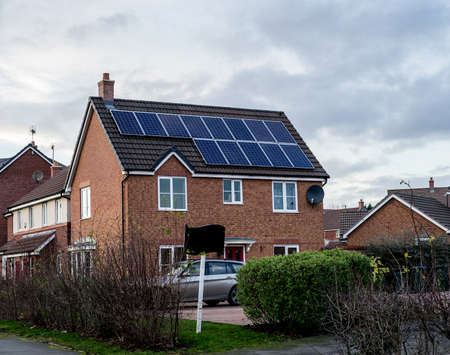 English House with Solar Panels on roof for electisityの写真素材