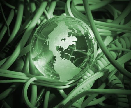 A photo of a globe over miscellaneous cablesの写真素材