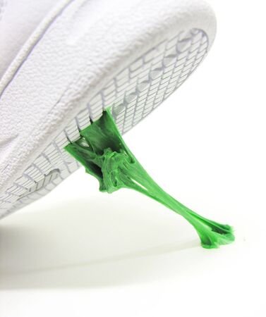 A photo of a new shoe stepping in gumの写真素材