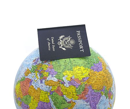 A photo of a passport on a globeの写真素材