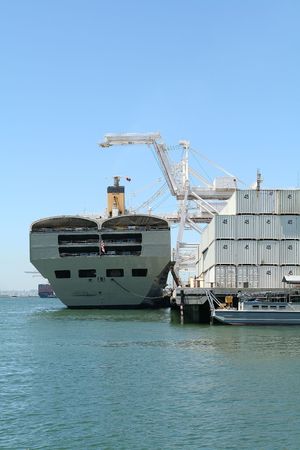 A ship in the harbor being unloadedの写真素材