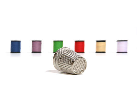 Thimble with thread in the backgroundの写真素材