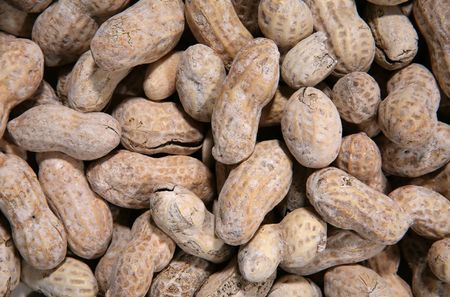 A background of peanuts in the shell