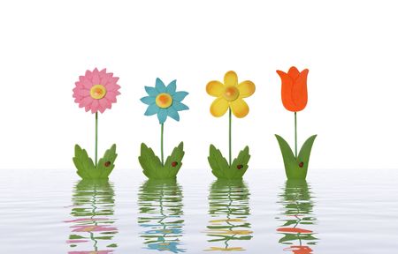 Four colorful toy flowers isolated over white