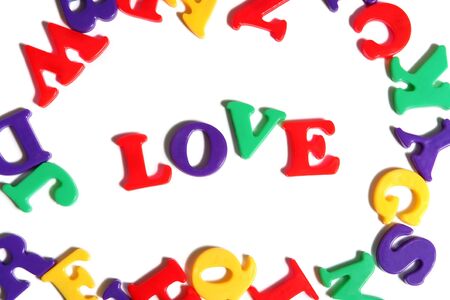 Love spelled out among colorful toy lettersの写真素材