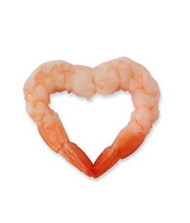 Two shrimp in the shape of a heart over whiteの写真素材