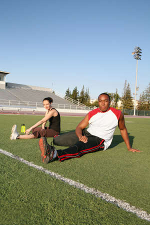 Man and woman stretching