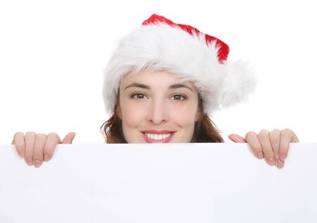 A pretty woman at Christmas holding a signの写真素材