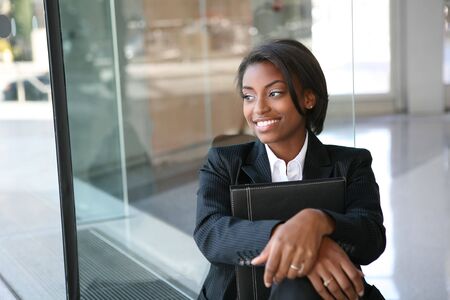 A pretty african american business woman at her companyの写真素材