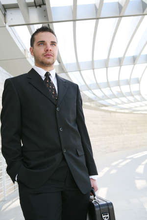 A young, handsome business man on his way to work