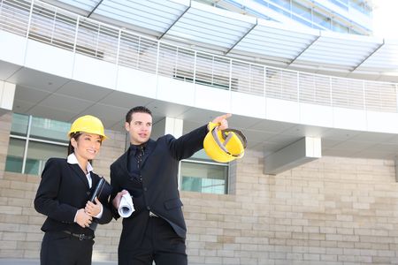 A man and woman architect on a construction site