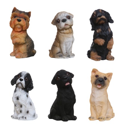 Cute dog breed statues isolated over white の写真素材