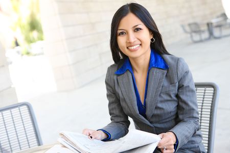 An attractive Indian business woman outside office building の写真素材