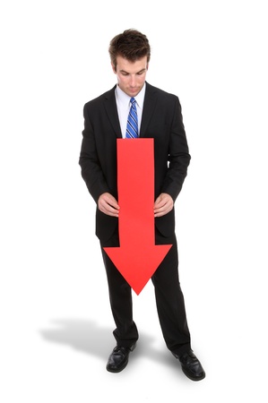 A business man holding a red arrow down indicating failureの写真素材