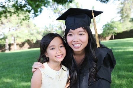 An asian mother and daughter celebrating a college graduation の写真素材