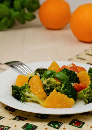 Salad with orange, tomato and broccoliの写真素材