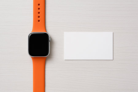 Premium Orange Smartwatch and Business Card Mockup â Flat lay on white wooden background with elegant, clean, and modern presentation.の素材