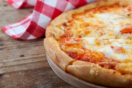 Homemade pizza on wooden tableの写真素材