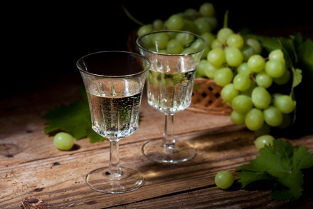 Old style still life with white wine and grapesの写真素材