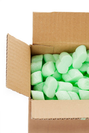 A cardboard box with packing foam pelletsの写真素材