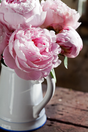 Bouquet of pink peonies in vaseの写真素材