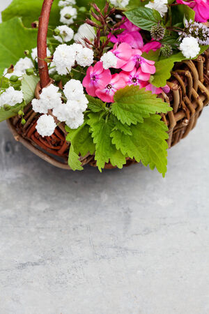 Bouquet of autumn flowers in basketの写真素材