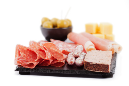 Charcuterie assortment and olives on white backgroundの写真素材