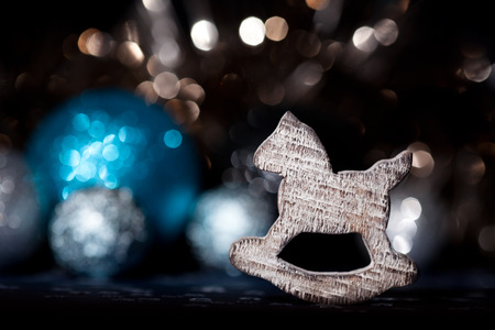 Christmas decoration rocking horse with bokeh backgroundの写真素材