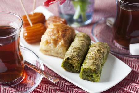 Variety of oriental sweets with cup of coffeeの写真素材