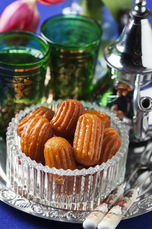 Variety of oriental sweets with cup of coffeeの写真素材