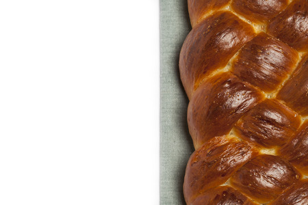 Freshly baked homemade challah bread on white background, with copy spaceの写真素材