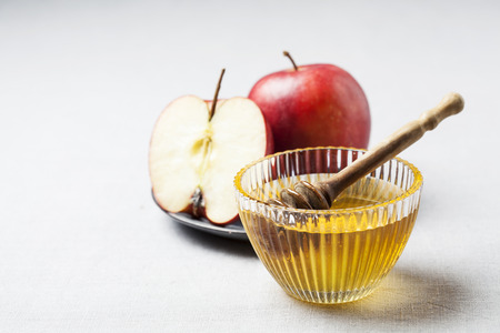 Rosh hashanah (jewish holiday) concept: honey, apple and pomegranateの写真素材