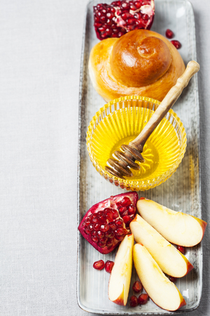 Rosh hashanah (jewish holiday) concept: honey, apple and pomegranateの写真素材