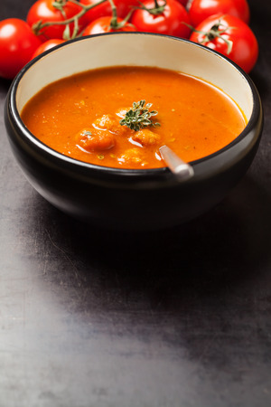 Homemade tomato soup with meatballs and thymeの写真素材