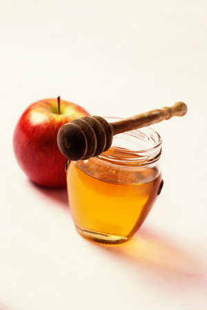 Apple and jar with honey and dipper. Rosh Hashana conceptの写真素材