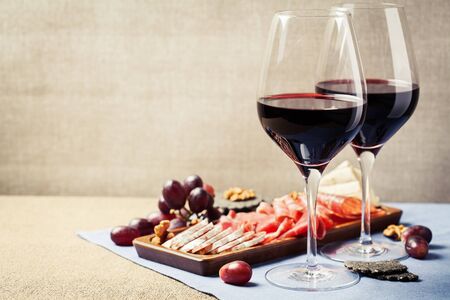 Two glasses of red wine with charcuterie assortment, beaujolais conceptの写真素材