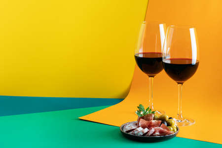 Two glasses of red wine with charcuterie assortment, beaujolais conceptの写真素材