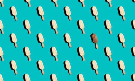 Seamless pattern with ice cream sticks on bright blue backgroundの写真素材