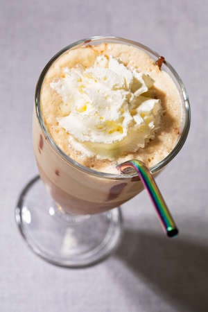 coffee drink in tall glass with metal reusable strawの写真素材