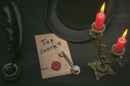 Top secret document information. Privacy. Forbidden material. Key to unraveling. Secret clue concept background.の写真素材