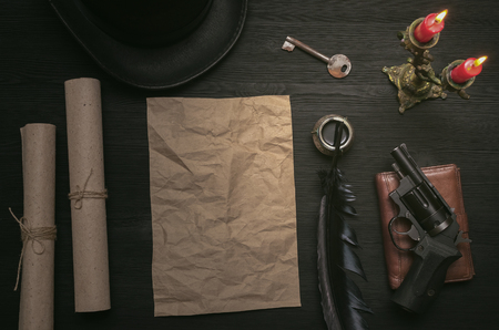 Envelope with top secret message. Key to unraveling. The clue. Detective desk table concept.の写真素材