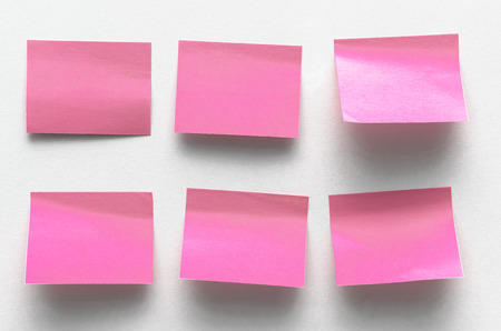 Blank sticker label isolated on the white wall surface background with copy space. To do list. Plans.の写真素材