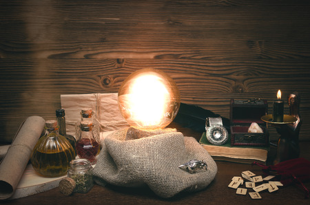 Crystal ball and tarot cards on fortune teller desk. Future reading concept. Paranormal magic table.の写真素材